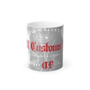 The Color Morphing Mug, 11oz by Printify is a white ceramic mug that showcases a grayscale design with red gothic text reading "Old Customs" and other decorative elements. The background features detailed, overlapping graphics that create a grungy, layered appearance. It also has a heat-reactive surface that reveals hidden details when hot liquid is poured in for an added element of surprise.